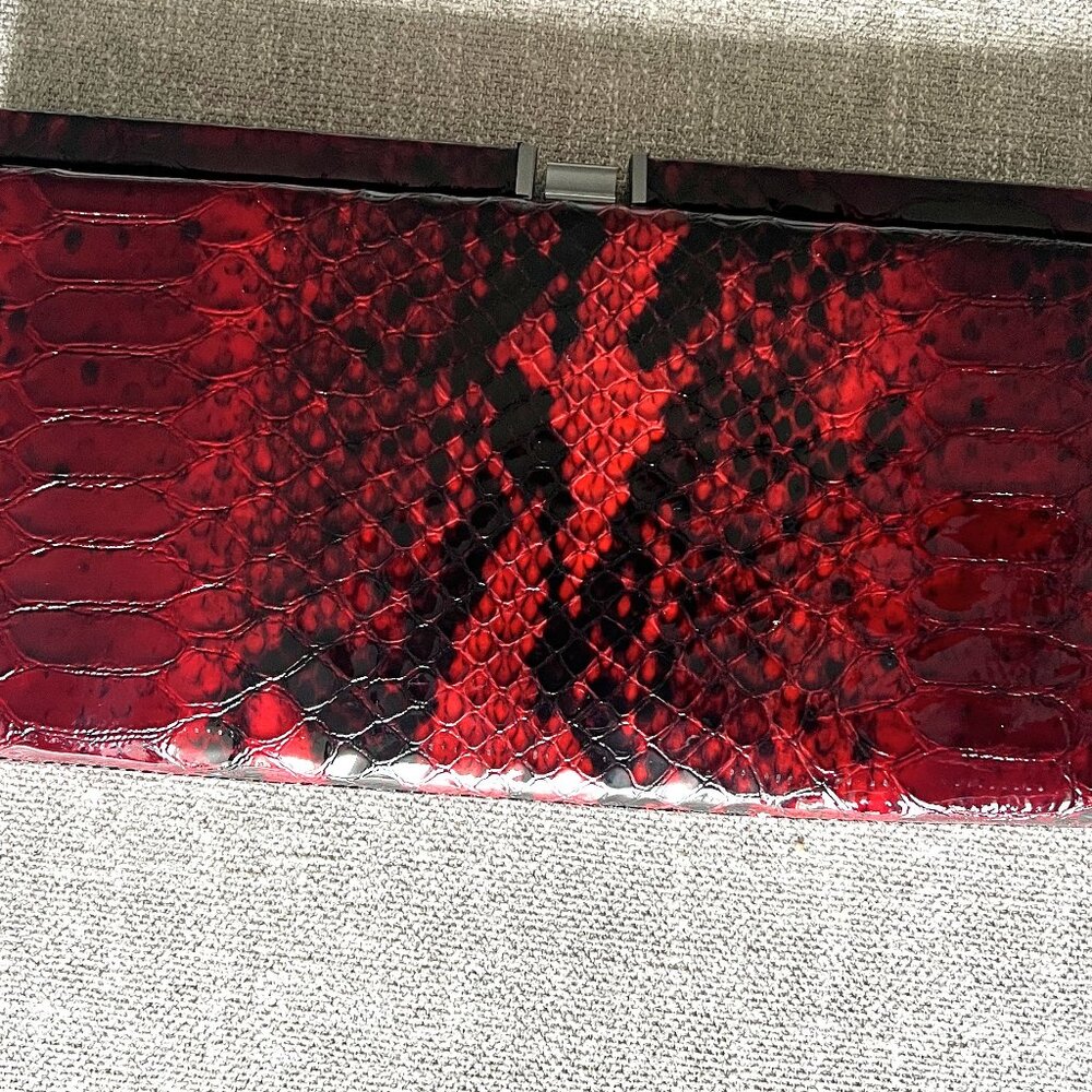 The Danier Leather Red and Black Crocodile Print Clutch Purse with Chain Strap